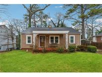 Charming single-story home with a well-maintained lawn and a quaint covered porch at 2177 Mulberry St, Atlanta, GA 30344
