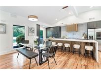 Bright, open kitchen featuring a large island with bar seating and modern lighting at 2649 Sunrise Ne Dr, Atlanta, GA 30345