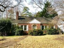 Charming brick home with a classic design and mature landscaping at 345 Shadowmoor Dr, Decatur, GA 30030