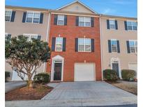 Charming townhome with a well-manicured lawn and a one car garage, perfect for modern living at 5362 Hickory Nw Knl, Norcross, GA 30071