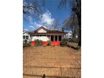 Charming single-Gathering home with a cozy front porch and landscaped yard, perfect for relaxing outdoors at 633 Langston Sw Dr, Atlanta, GA 30315