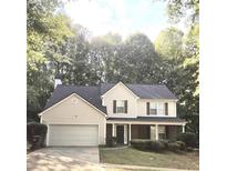 Charming two-story home with a two-car garage and lush green landscaping at 2969 Wynhaven Oaks Way, Lawrenceville, GA 30042