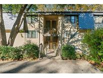 Condominium exterior showcasing well-maintained landscaping and a welcoming two-story entrance at 188 Triumph Nw Dr, Atlanta, GA 30327