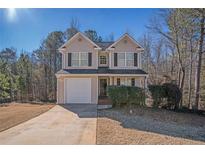 Charming two-story home featuring a well-maintained lawn and attached garage at 30 Sampson Ct, Covington, GA 30016