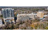 An aerial view of a condominium building located in a vibrant, tree-lined neighborhood at 2255 Peachtree Ne Rd # 426, Atlanta, GA 30309