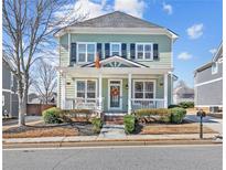 Charming two-story home with a welcoming front porch and manicured landscaping at 2539 Preston View Sw Ct, Atlanta, GA 30315