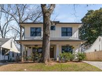 Charming two-story home with a landscaped front yard and modern farmhouse design at 231 Sisson Ne Ave, Atlanta, GA 30317