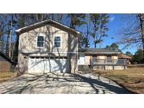 Charming two-story home with attached garage and welcoming front porch at 3924 Veracruz Dr, Decatur, GA 30034