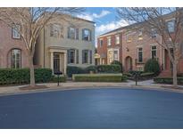 Charming two-story brick townhomes with manicured landscaping and inviting curb appeal at 3112 Neal Ct, Cumming, GA 30041