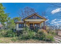 Charming bungalow featuring a cozy front porch and mature landscaping at 3630 Union Ave, Hapeville, GA 30354