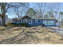 Charming single-story home with a well-maintained front yard and a classic suburban aesthetic at 1660 Almand Creek Sw Dr, Conyers, GA 30094