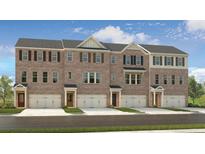 Attractive brick townhome with a single-car garage, complemented by well-maintained landscaping and inviting entrances at 1741 Lansmere Sw St, Marietta, GA 30008