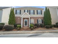 Charming two-story home with brick and siding, showcasing manicured landscaping and a welcoming entrance at 3272 Tiara Sw Cir, Atlanta, GA 30311