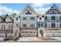 Charming townhomes with a two-car garage and beautifully designed architecture at 244 Trecastle Sq, Canton, GA 30114