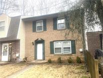 Charming two-story brick home with green shutters and a well-maintained front yard at 3531 Laurie Jo Sw Dr, Marietta, GA 30008