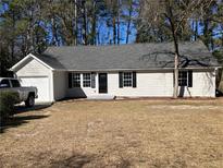 Charming single-story home with neutral siding, black shutters, and a single-car garage at 2678 Brook Park Way, Atlanta, GA 30340