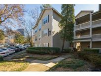 Charming condo building with manicured landscaping and ample parking at 1250 Parkwood Se Cir # 2114, Atlanta, GA 30339