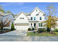 Beautiful two-story home with white siding, well-manicured lawn, attached two car garage, and inviting front porch at 2845 Jims Ne Rd, Marietta, GA 30066