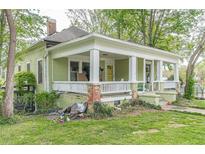 Covered porch with white pillars and columns, offering an inviting entrance and outdoor living space at 3670 Union Ave, Atlanta, GA 30354