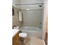 Updated bathroom with tiled shower, modern fixtures, and a tiled floor at 5400 Roswell Rd # K1, Atlanta, GA 30342