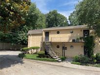Charming two-story apartment building with mature trees and landscaping at 5400 Roswell Rd # K1, Atlanta, GA 30342