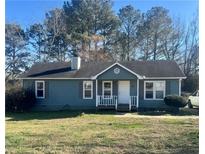 Charming single-story home with a cozy front porch and well-maintained lawn at 57 Haven Ridge Dr, Carrollton, GA 30116