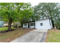 Charming single Gathering home featuring a well-maintained yard and a private driveway at 1995 Northerly Way, Stone Mountain, GA 30088