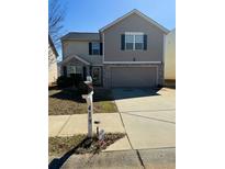 Charming two-story home featuring a gray color palette, a two-car garage, and well-manicured lawn at 419 Parkside Way, Mcdonough, GA 30253