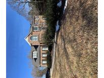 Charming brick two-story home with meticulously landscaped yard, and mature trees at 69 Ridgeway Dr, Villa Rica, GA 30180