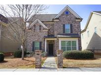 Charming brick two-story home with manicured landscaping and inviting entryway at 3534 S Sherwood Se Rd, Smyrna, GA 30082
