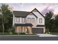 Charming two-story home with brick and siding, inviting covered porch and attached garage at 7685 Homer Dr, Cumming, GA 30028