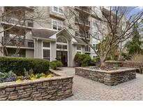 Beautiful condo community with stone landscaping and well-maintained exterior at 1302 River Green Nw Dr # 1302, Atlanta, GA 30327