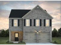 Charming two-story brick home featuring a two-car garage and well-manicured landscaping at 5320 Tolar Rd, South Fulton, GA 30213