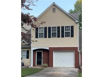 Charming home with a brick facade, a single-car garage, and classic black shutters at 6706 Sunset Valley Cir, Rex, GA 30273