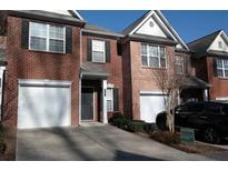 Charming brick townhouse with a private driveway and a one car garage at 3835 Pleasant Oaks Dr, Lawrenceville, GA 30044