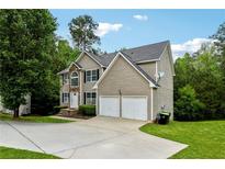 Charming two-story home with stone accents, two-car garage, and well-manicured lawn at 4240 N Braves Cir, Douglasville, GA 30135