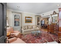 Inviting living room with bookshelves, a plush sofa, area rug and elegant furnishings at 30 Collier Nw Rd # 6, Atlanta, GA 30309