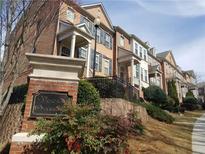 Beautiful brick townhomes at Vinings Overlook with landscaped grounds and well-maintained exteriors at 2823 Mount Wilkinson Se Pkwy # 14, Atlanta, GA 30339