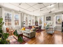 Bright living room with hardwood floors, large windows, and a comfortable seating area at 138 Kirkwood Ne Rd # 9, Atlanta, GA 30317
