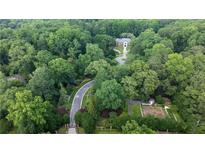 Stunning aerial view of a secluded home surrounded by lush trees and landscape at 4615 Northside Dr, Atlanta, GA 30327