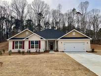 Charming one-story home with a well-manicured lawn and classic red window shutters at 5311 Tuscany Drive, Douglasville, GA 30135