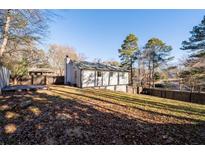 Expansive backyard with a deck, offering ample space for outdoor activities and relaxation at 2571 Hamill Dr, Buford, GA 30519