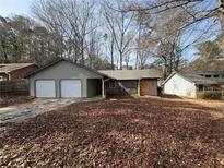 Charming single-story home featuring a two-car garage and stone accents at 424 Independence Dr, Jonesboro, GA 30238