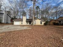 Charming single-story home with a cozy front yard and driveway at 5676 Marbut Rd, Lithonia, GA 30058