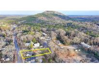 View of a neighborhood lot in front of a mountain highlighting the area, street and community at 5435 E Mountain St, Stone Mountain, GA 30083