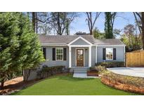 Charming single-story home with gray siding, a manicured lawn, and a welcoming front entrance at 1784 Hickory Rd, Atlanta, GA 30341