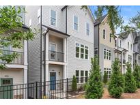 Charming new construction townhomes with modern designs, attractive facades, and small landscaped yards at 484 Hammons Way, Atlanta, GA 30315