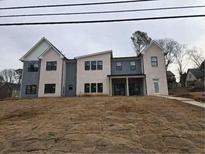 New construction two-story home featuring a brick exterior and large windows on a spacious lot at 436 Paden Dr, Lawrenceville, GA 30044