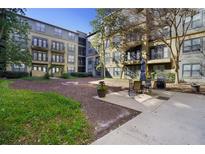 Apartment building exterior with courtyard and outdoor seating area at 400 17Th Nw St # 2427, Atlanta, GA 30363