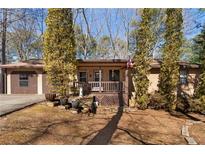 Charming single story home featuring a welcoming front porch and well maintained front yard at 28 East Boxwood Dr, Cartersville, GA 30121